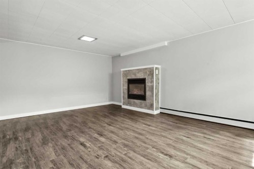 67 Hooke Road Sw, Calgary, AB - Indoor Photo Showing Other Room