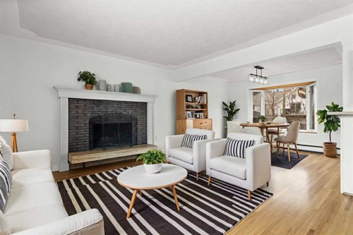 67 Hooke Road Sw, Calgary, AB - Indoor Photo Showing Living Room With Fireplace