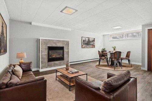 67 Hooke Road Sw, Calgary, AB - Indoor Photo Showing Living Room With Fireplace