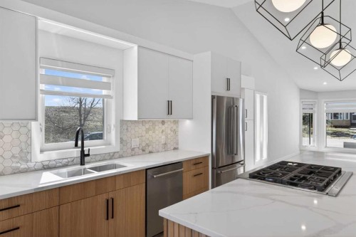 42 Sunvista Crescent Se, Calgary, AB - Indoor Photo Showing Kitchen With Double Sink With Upgraded Kitchen