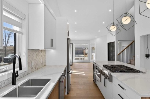 42 Sunvista Crescent Se, Calgary, AB - Indoor Photo Showing Kitchen With Double Sink With Upgraded Kitchen
