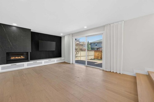 42 Sunvista Crescent Se, Calgary, AB - Indoor Photo Showing Living Room With Fireplace