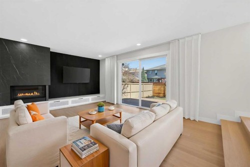 42 Sunvista Crescent Se, Calgary, AB - Indoor Photo Showing Living Room With Fireplace