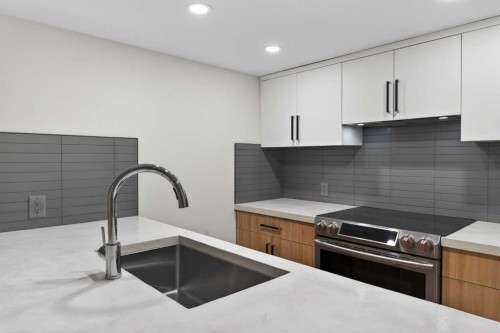 42 Sunvista Crescent Se, Calgary, AB - Indoor Photo Showing Kitchen With Upgraded Kitchen