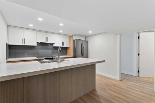 42 Sunvista Crescent Se, Calgary, AB - Indoor Photo Showing Kitchen With Double Sink