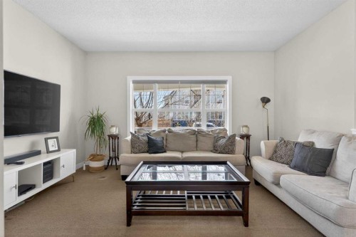 50 Silverado Plains Circle Sw, Calgary, AB - Indoor Photo Showing Living Room