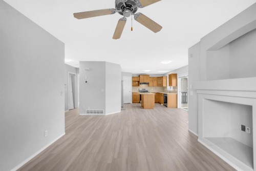 171 Willowbrook Drive Nw, Airdrie, AB - Indoor With Fireplace