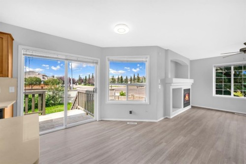 171 Willowbrook Drive Nw, Airdrie, AB - Indoor With Fireplace