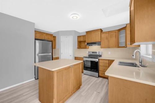 171 Willowbrook Drive Nw, Airdrie, AB - Indoor Photo Showing Kitchen With Double Sink