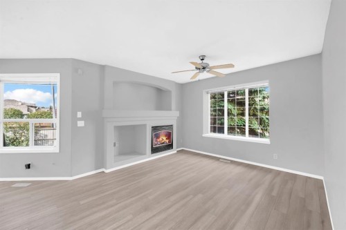 171 Willowbrook Drive Nw, Airdrie, AB - Indoor Photo Showing Living Room With Fireplace