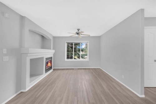 171 Willowbrook Drive Nw, Airdrie, AB - Indoor With Fireplace