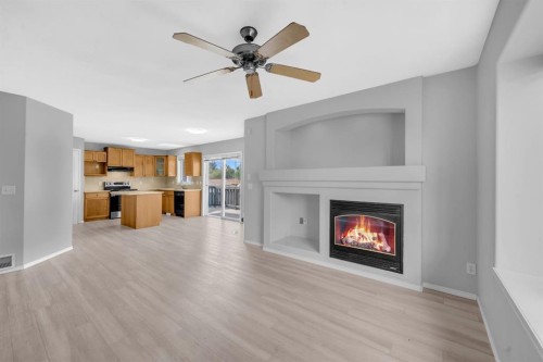 171 Willowbrook Drive Nw, Airdrie, AB - Indoor Photo Showing Living Room With Fireplace