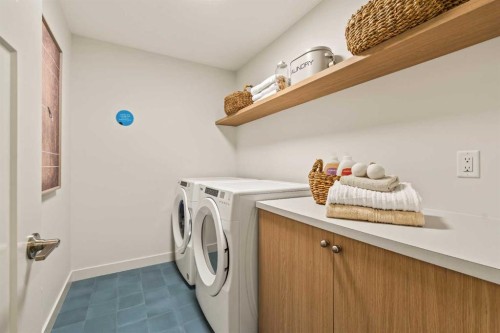 103 Silver Spruce Grove, Calgary, AB - Indoor Photo Showing Laundry Room