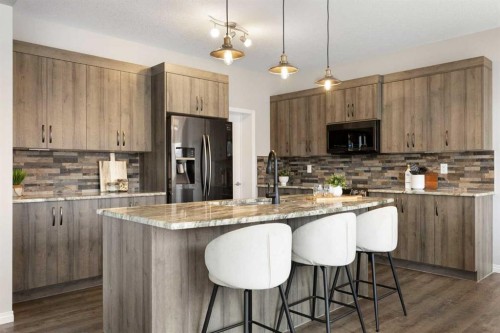 1 Osborne Common Sw, Airdrie, AB - Indoor Photo Showing Kitchen With Upgraded Kitchen