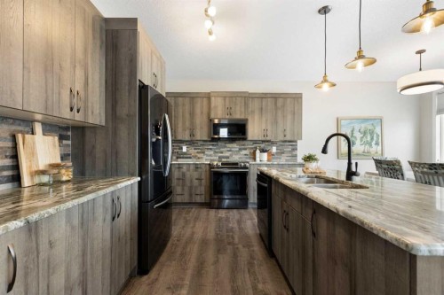 1 Osborne Common Sw, Airdrie, AB - Indoor Photo Showing Kitchen With Double Sink With Upgraded Kitchen