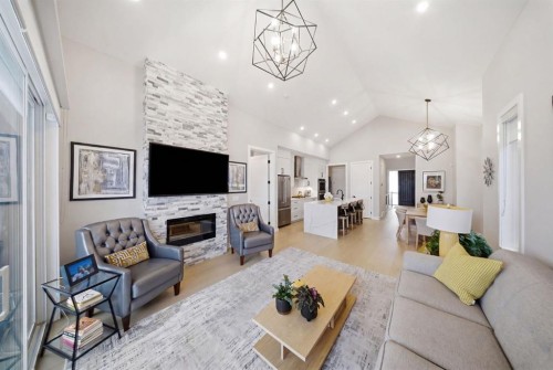 408 Crestridge Common Sw, Calgary, AB - Indoor Photo Showing Living Room With Fireplace