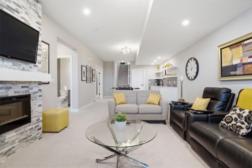 408 Crestridge Common Sw, Calgary, AB - Indoor Photo Showing Living Room With Fireplace