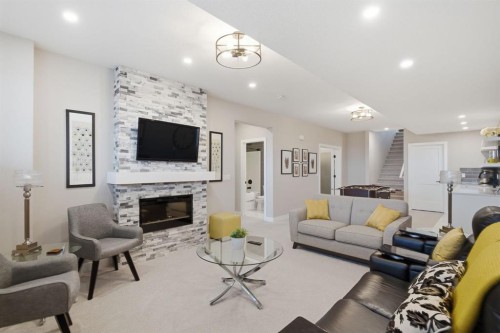 408 Crestridge Common Sw, Calgary, AB - Indoor Photo Showing Living Room With Fireplace