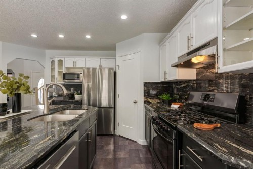 82 Hidden Ridge View Nw, Calgary, AB - Indoor Photo Showing Kitchen With Stainless Steel Kitchen With Double Sink With Upgraded Kitchen