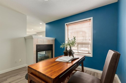 82 Hidden Ridge View Nw, Calgary, AB - Indoor With Fireplace