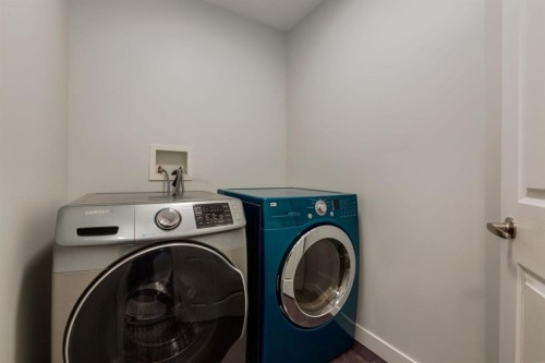 82 Hidden Ridge View Nw, Calgary, AB - Indoor Photo Showing Laundry Room