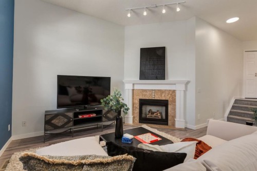 82 Hidden Ridge View Nw, Calgary, AB - Indoor Photo Showing Living Room With Fireplace