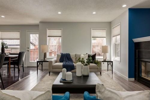 82 Hidden Ridge View Nw, Calgary, AB - Indoor Photo Showing Living Room With Fireplace