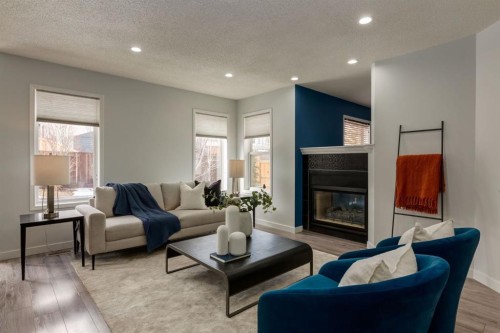 82 Hidden Ridge View Nw, Calgary, AB - Indoor Photo Showing Living Room With Fireplace