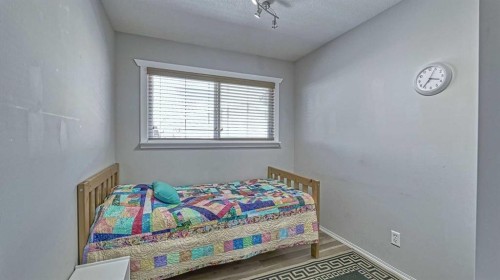 64 Midglen Drive Se, Calgary, AB - Indoor Photo Showing Bedroom