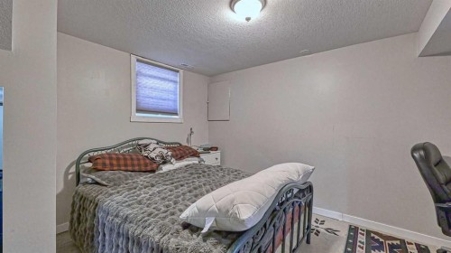 64 Midglen Drive Se, Calgary, AB - Indoor Photo Showing Bedroom