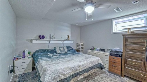 64 Midglen Drive Se, Calgary, AB - Indoor Photo Showing Bedroom