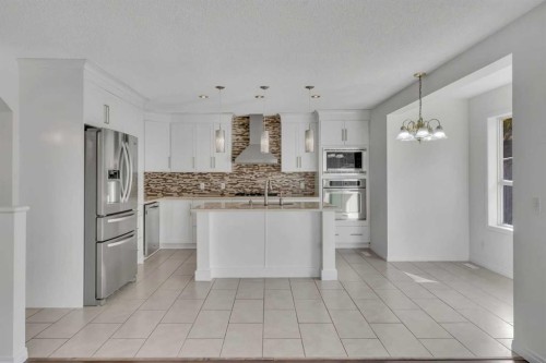 338 Panamount Drive Nw, Calgary, AB - Indoor Photo Showing Kitchen With Upgraded Kitchen
