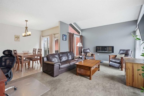 2608 Deer Side Drive Se, Calgary, AB - Indoor Photo Showing Living Room With Fireplace