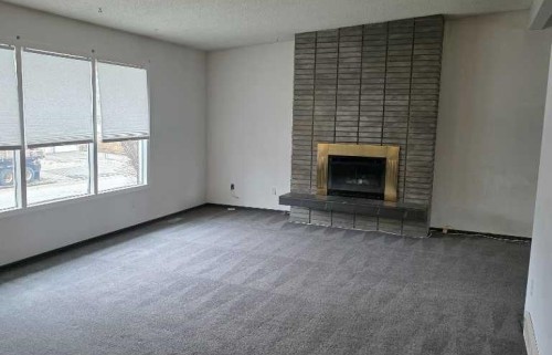 2822 13 Avenue Se, Calgary, AB - Indoor Photo Showing Living Room With Fireplace