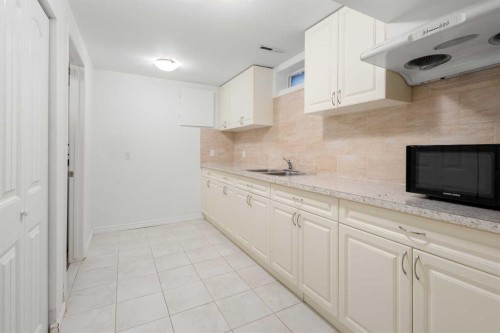4823 Vanguard Road Nw, Calgary, AB - Indoor Photo Showing Kitchen With Double Sink
