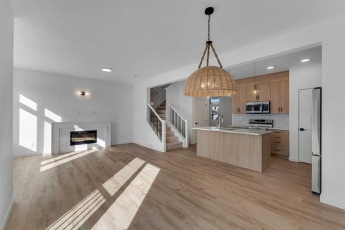 150 Belvedere Crescent Se, Calgary, AB - Indoor Photo Showing Kitchen With Fireplace