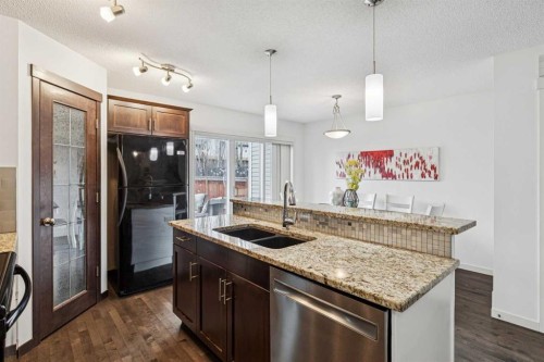 524 Cranston Drive Se, Calgary, AB - Indoor Photo Showing Kitchen With Double Sink