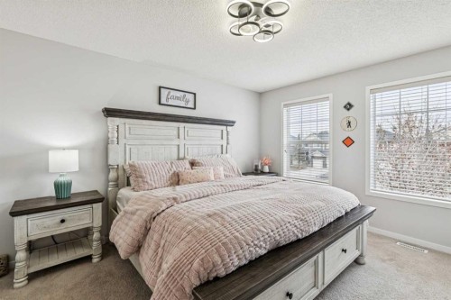 524 Cranston Drive Se, Calgary, AB - Indoor Photo Showing Bedroom