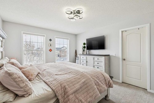 524 Cranston Drive Se, Calgary, AB - Indoor Photo Showing Bedroom