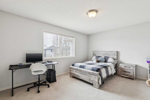 524 Cranston Drive Se, Calgary, AB - Indoor Photo Showing Bedroom