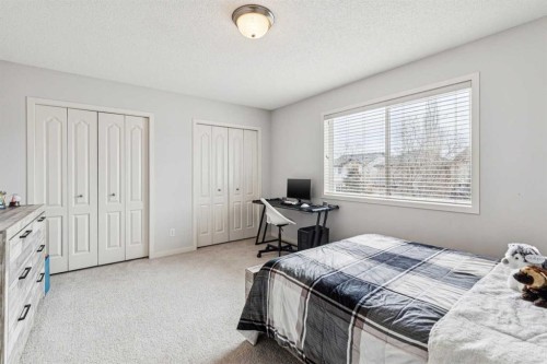 524 Cranston Drive Se, Calgary, AB - Indoor Photo Showing Bedroom