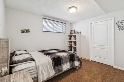 524 Cranston Drive Se, Calgary, AB - Indoor Photo Showing Bedroom