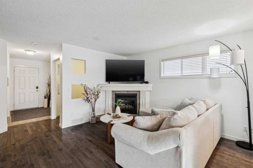 524 Cranston Drive Se, Calgary, AB - Indoor Photo Showing Living Room With Fireplace