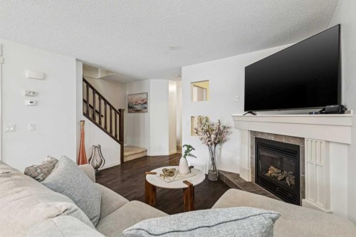 524 Cranston Drive Se, Calgary, AB - Indoor Photo Showing Living Room With Fireplace