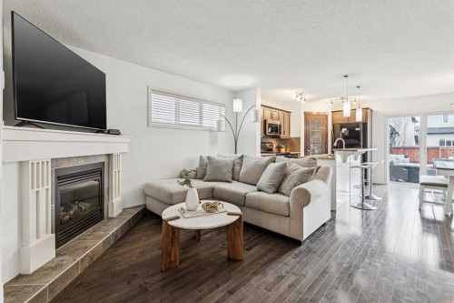 524 Cranston Drive Se, Calgary, AB - Indoor Photo Showing Living Room With Fireplace