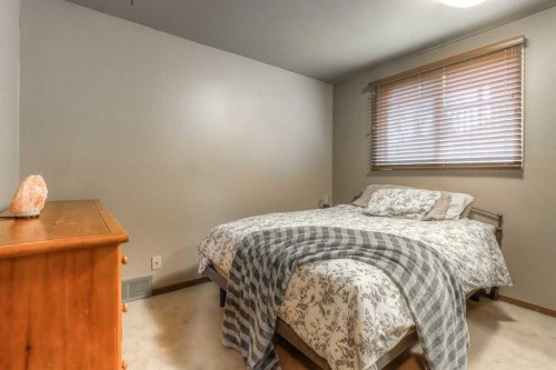 172 Oaktree Lane Sw, Calgary, AB - Indoor Photo Showing Bedroom