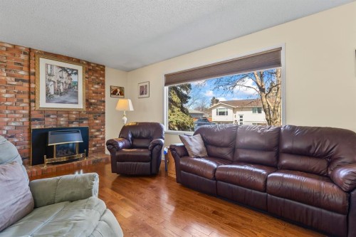 308 Lynnover Way Se, Calgary, AB - Indoor Photo Showing Living Room With Fireplace