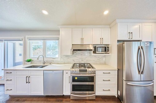 103 Pump Hill Road, Calgary, AB - Indoor Photo Showing Kitchen With Stainless Steel Kitchen With Double Sink With Upgraded Kitchen