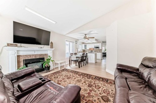 7165 California Boulevard Ne, Calgary, AB - Indoor Photo Showing Living Room With Fireplace