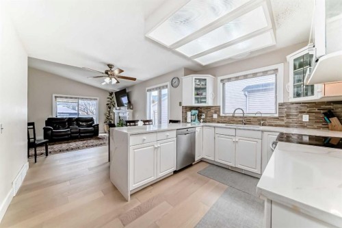 7165 California Boulevard Ne, Calgary, AB - Indoor Photo Showing Kitchen With Double Sink